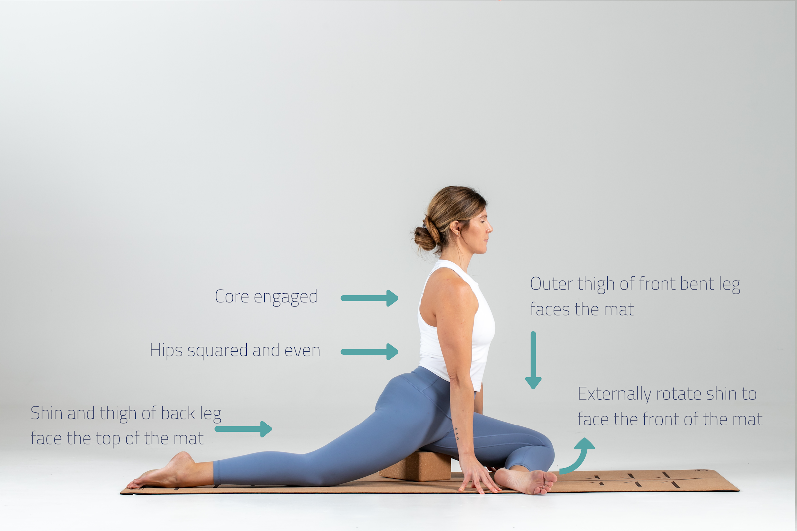 Pigeon pose demonstration showing proper hip opening technique