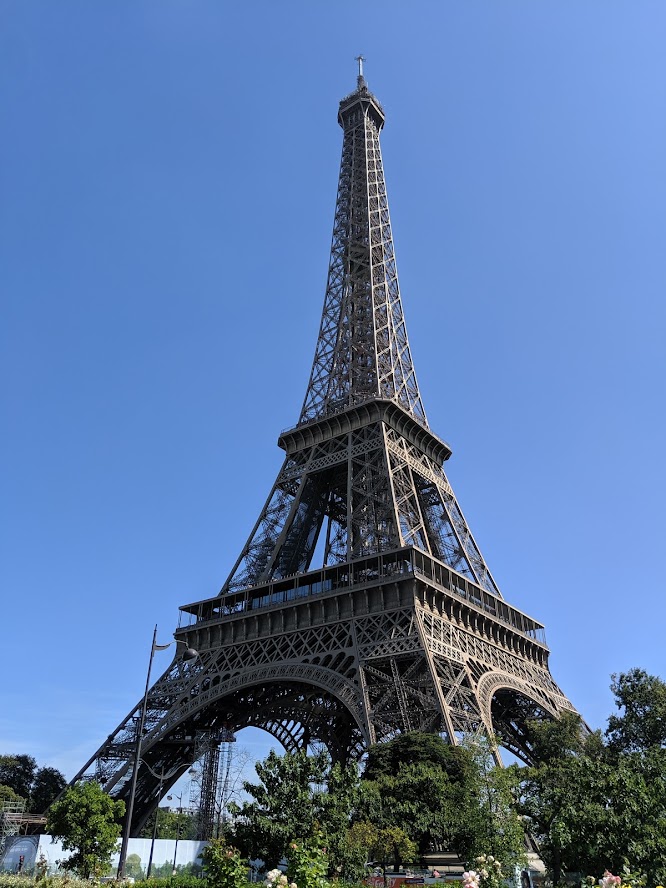 The Eiffel Tower standing against a clear blue sky in Paris