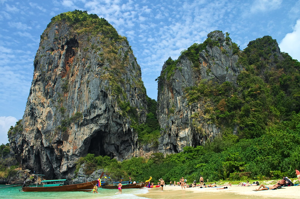 Railay Beach, Krabi, Thailand — limestone cliffs, longtail boats, and turquoise water